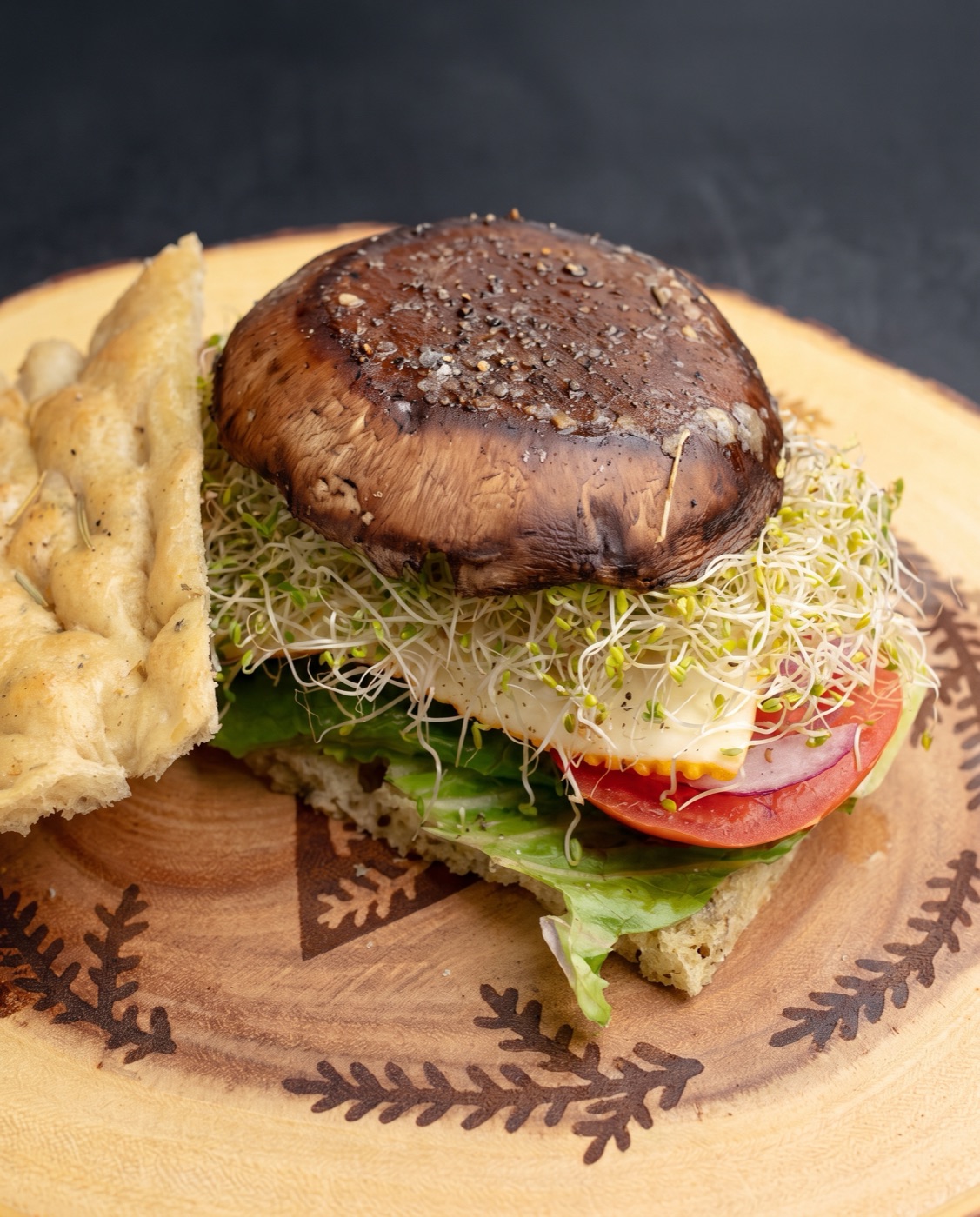 Portobello mushroom sandwich on focaccia with alfalfa sprouts