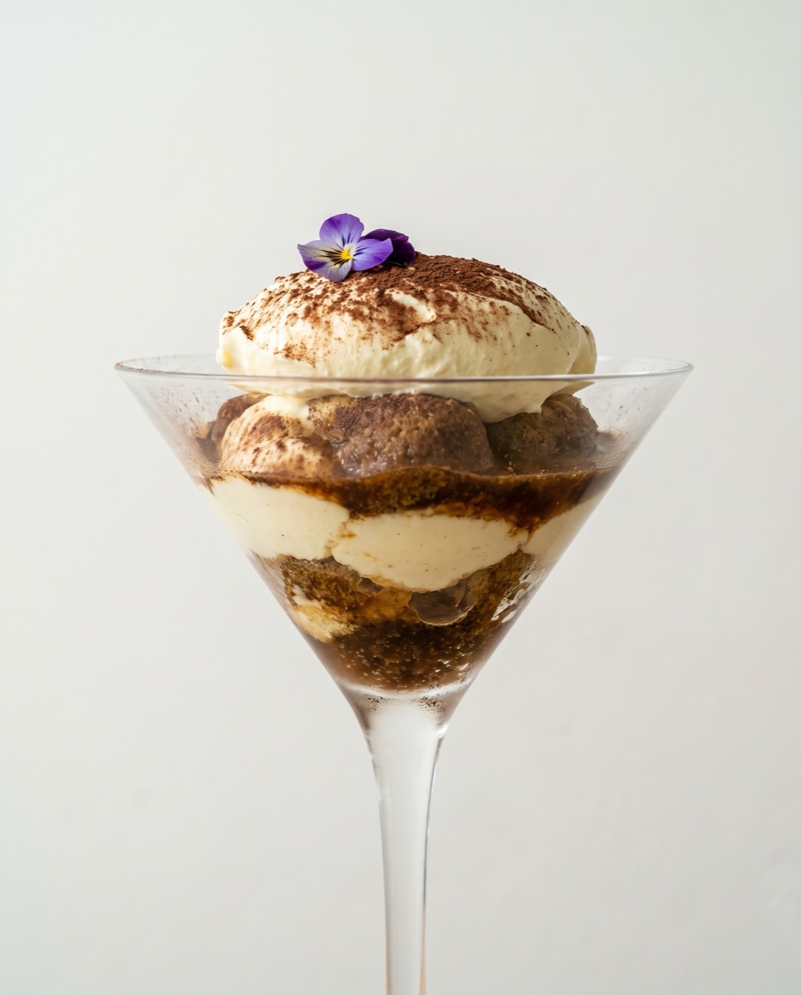 Tiramisu served in a stemmed glass